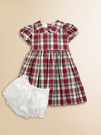 Adorned with a festive plaid print and matching tie, this gorgeous cotton frock with matching bloomers will make your little girl feel like a sugarplum fairy.Peter Pan collarShort puff sleevesBack buttonsWaistband with ribbon tieFull skirtFully linedCottonDry cleanImported Please note: Number of buttons may vary depending on size ordered. 