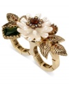 Fashion fully bloomed, by Betsey Johnson. This two-finger ring displays pearl colored flowers with topaz crystal accents, green crystal gems, and gold tone leaves. Stretches to fit fingers. Crafted in gold tone mixed metal. Size 7-1/2.