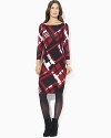 Style and comfort fashionably intertwine in a soft cotton sweater dress with an eye-catching print.