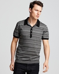 A handsome polo for your modern, relaxed-and-refined wardrobe, featuring alternating tonal stripes and a classic fit.