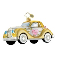 A golden, glittering car holiday ornament.