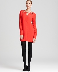 Posh cutout details, a major trend this fall, enrich this seductive BCBGMAXAZRIA dress with festive flair.