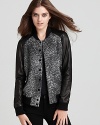 Our continued fascination with bold animal prints is clearly celebrated with Rebecca Taylor's bomber jacket-- revamped with contrast leather sleeves for an unmistakably feminine look and added edge.