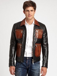 Two shades of supple leather, tailored in a bomber style and finished with bold zipper details.Point collarZip frontZipper patch pocketsZipper cuffsAbout 24 from shoudler to hemLeatherDry clean by leather specialistImported