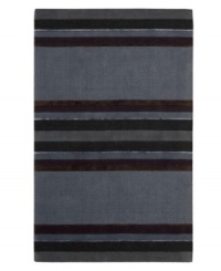 Linear designs are accented with exotic faux silk to create a timeless palette in the Sahara area rug from Calvin Klein. Crafted by skilled artisans in India, it features generously thick wool and viscose fibers woven to create remarkable strength and impeccable elegance.