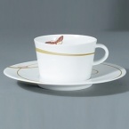 For over two centuries Raynaud has created unique Limoges porcelain, with a marked preference for relief shapes and generously colored and gilt decorations. Metamorphoses is a striking pattern of red and gold with a butterfly motif.