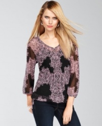 INC's petite top features a flattering peasant silhouette and a feminine placed print.