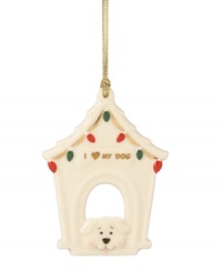 Deck the tree with your favorite pup this Christmas. This precious porcelain dog house is painted with red and green lights and finished with gold detailing.