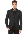 This Perry Ellis blazer offers a sleek slim fit and classic solid design perfect for the office or after party.