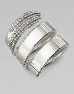 An alluring ribbed snake coils around the wrist, capped by dazzling Swarovski crystals at one end.CrystalSilverplatedDiameter, about 2¼Width, about 2¾Made in Italy