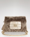 Lavish lamb fur makes a sophisticated soiree-ready statement on this DIANE von FURSTENBERG clutch, which hangs delicately from a glinting chain strap.