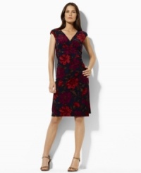 Fluid matte jersey drapes beautifully in a slinky, ruched silhouette featuring cap sleeves and a chic, crossover neckline, from Lauren by Ralph Lauren. (Clearance)