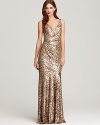 Make a glittering entrance in this lavish David Meister sequin gown, boasting luxurious draping for an elegant finish.