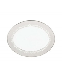 This large bone china platter will hold attention with a delicate floral design with textured white beads and elegant platinum trim. From Lenox's dinnerware and dishes collection.