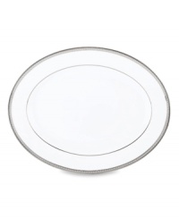 Metropolitan sensibility and modern design combine in this understated white bone china platter from Lenox's collection of dinnerware and dishes. Platinum gild along the edge is enhanced by a clean, platinum geometric pattern reminiscent of architectural accents.