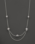 This sterling silver choker from Paul Morelli is the perfect backdrop for his meditation bell pendants.