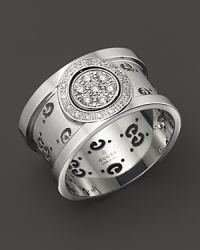 Gucci's iconic Gs circle a gleaming band of 18K. white gold.