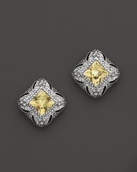 An art-deco style stud earring, in sterling silver with a canary crystal center stone.