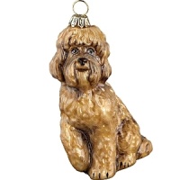 Mouth blown and hand painted by some of the finest artists in Poland, this Labradoodle ornament is a favorite for hanging on the tree. This collection has been taken to a whole new level in detail, uniqueness and artistic direction.