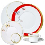 For over two centuries Raynaud has created unique Limoges porcelain, with a marked preference for relief shapes and generously colored and gilt decorations. Metamorphoses is a striking pattern of red and gold with a butterfly motif.