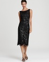 Tadashi Shoji channels the classic glamour of the 20's with this sequin embellished dress, finished with a sweet scalloped hem.