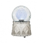 Modeled after the Times Square skyline, this 2012 Waterford snowglobe has a footed silvery base that's etched in a Deco pattern and states Let There Be Friendship.