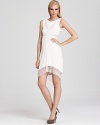 This curve-defining BCBGMAXAZRIA dress flaunts lace insets for a romantic finish.