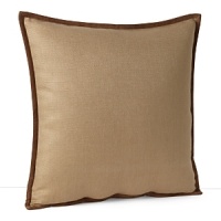 This decorative throw pillow adds texture in neutral linen with soft suede trim.