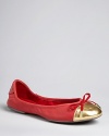 MICHAEL Michael Kors takes these ballet flats from workday to wow with oversized metallic cap toes tied off with a bow with goldtone metal charms.