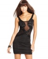 Some like it hot: sheer mesh insets endow this sequin-adorned mini dress with extra-sultry style!