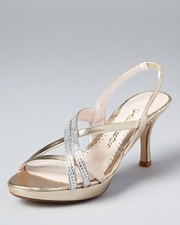 Two rhinestone-encrusted straps race across Caparro's Yara slingback sandal, an evening-ready style with dazzling glamour.