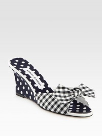 Vivid polka dots add charm to this mule wedge mixed with a classic gingham print and fine leather trim. Self-covered wedge, 3 (75mm)Fabric and grosgrain ribbon upper with leather trimGrosgrain liningLeather solePadded insoleMade in Italy