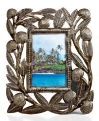 Carved with the bounty of Haiti's all-important breadfruit tree, this hand-cut and hammered picture frame tells a unique story in cleverly re-purposed steel.