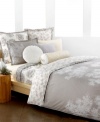 The Snow Willow comforter set captures the beauty of winter in neutral colors fit for all seasons. Scattered white branches grow across a muted, geometric design while the reverse presents a collection of these branches in calming color. (Clearance)