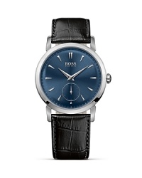 Featuring an ultra slim movement and case, a curved blue dial and an embossed crocodile black leather strap, this timepiece is elegant on the wrist.