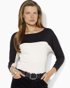 Eye-catching color-blocking enlivens a batwing-sleeved top, knit from soft cotton for cozy-chic style.