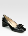 Patent leather pump with a logoed kiltie and square toe. Self-covered heel, 1½ (40mm)Patent leather upperLeather liningRubber solePadded insoleImported