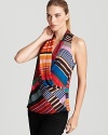 Bright multi-colored stripes add a colorful dimension to this striking Trina turk top--a criss-cross front lends an alluring look and shape to this sleeveless standout.