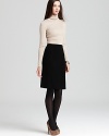 Effortlessly elegant, this Anne Klein sweater dress eases into the season with a sumptuous ribbed top and sleek contrast skirt.