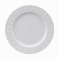 Modern in design with a raised circular pattern, made from French Limoges Porcelain. Dishwasher and microwave safe.