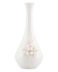 Sculpted forget-me-knots pop with a tinge of pink against this glossy white Flora bud vase. A quiet beauty in graceful Lenox porcelain.