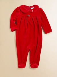 A beautiful long-sleeved footed coverall in plush velour is highlighted with pretty puffed sleeves and an empire waist.Peter Pan collarLong sleevesBack buttonsGathered empire waistBottom snaps80% cotton/20% polyesterMachine washImported Please note: Number of buttons may vary depending on size ordered. 