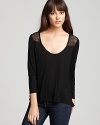 Beautiful lace accents and an asymmetric hem add on-trend flourish to this simple yet elegant Soft Joie top.