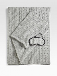 The ultimate in luxury and comfort, this soft, cable-knit set includes a travel blanket and sleep mask that tucks neatly into a matching carry case. Carry case doubles as a pillowcase for airline pillow. Pillow not included Four-ply yarn Carry case has zip closure Blanket, 36 X 60 Cashmere Dry clean Imported