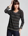 A tinge of sparkle shines up the stripes on this ALTERNATIVE sweater that's best paired with your favorite denim.