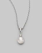 Simple and lovely, a white, round cultured Akoya pearl has a sparkling diamond accent, plus a chain and setting of 18k gold. 7mm white round cultured pearl Quality: A+ Diamond, 0.05 tcw 18k white gold Length, about 18 Spring ring clasp Imported