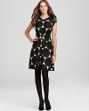 Oversized polka dots embolden a fit-and-flare kate spade new york dress for a striking retro statement. Polish it off with a dash of pearls and classic pumps.