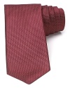 A micro houndstooth pattern lends a subtle look to this classic silk tie from Michael Kors.