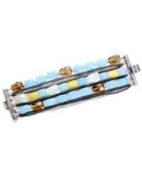 Earthy appeal. Kenneth Cole New York's triple row bracelet style combines semi-precious blue quartz and yellow jade with smokey glass beads. Set in silver and hematite tone mixed metal. Approximate length: 7-1/2 inches.