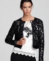 Exquisite in sequins, this Nanette Lepore jacket dazzles with a split collar and silky trim.